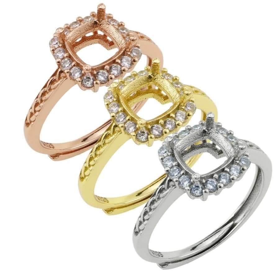 This customizable square ring comes with a rectangular 4x6mm center stone and cubic zirconia accents. Ring material is 925 Sterling Silver.